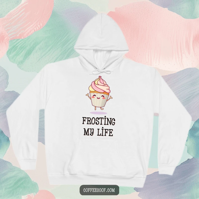 Funny cupcake character doing a happy dance with frosting, printed on a soft hoodie for cozy, sweet enjoyment.