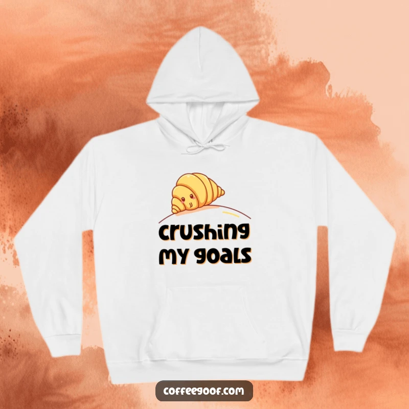 Funny Croissant Hoodie: Cheerful croissant character rolling down a hill, perfect for cozy baking vibes and comfort.