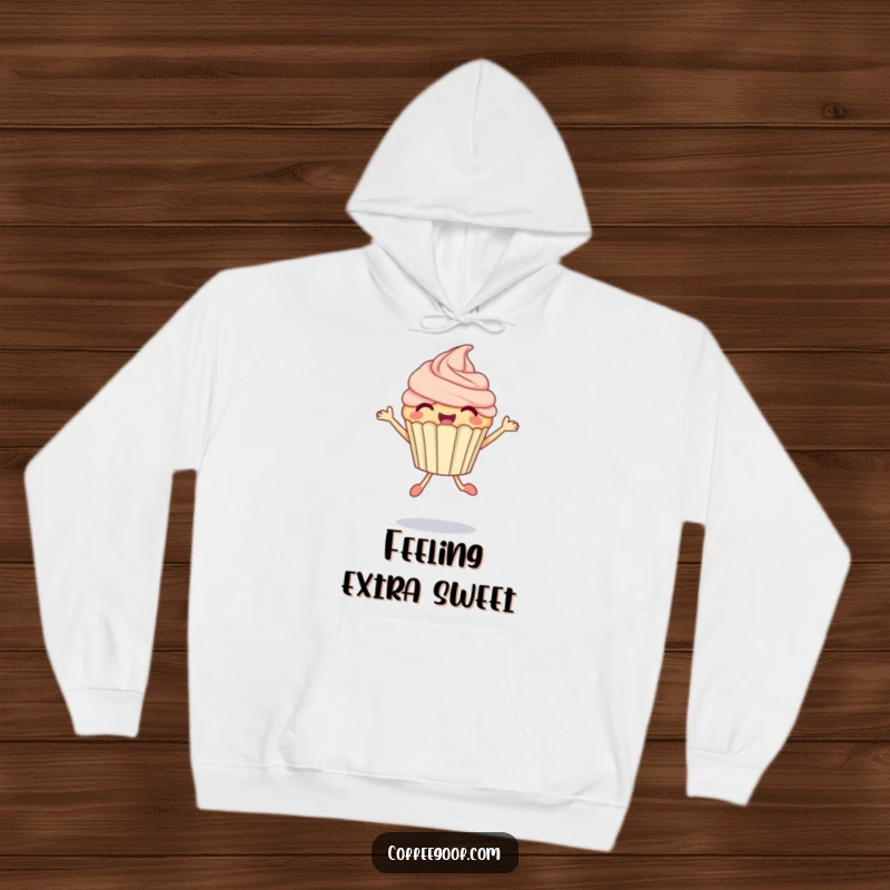 Funny Cupcake Hoodie depicting a delighted anthropomorphic cupcake in a bubbly jump, offering cozy sweetness and humor.