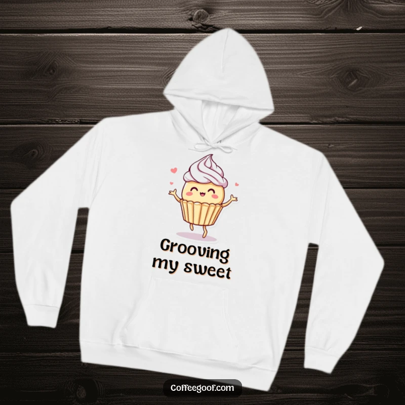 Funny hoodie featuring a whimsical muffin character in a delightful dance pose, complemented by swirling frosting details.