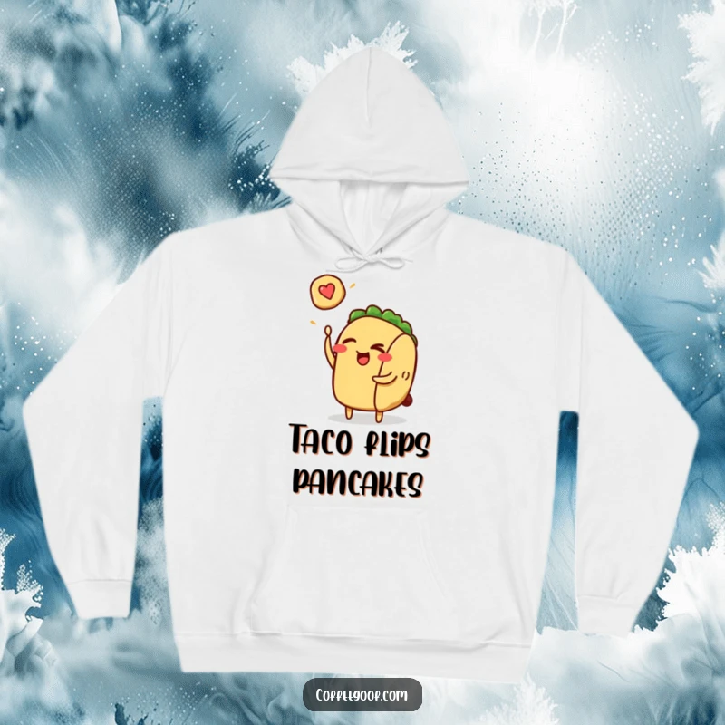 Funny taco character winking and flipping a pancake, printed on a soft hoodie for cozy, humorous wear.