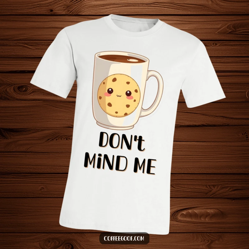 Funny t-shirt featuring a shy cookie cautiously peeking from behind a large coffee mug, a delightful portrayal of sweet introversion.